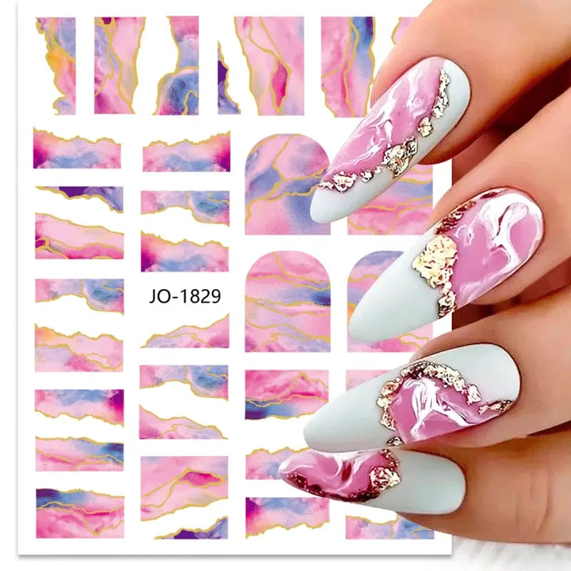 Nail art decals sheet with colorful pink and purple marble swirls and gold foil accents