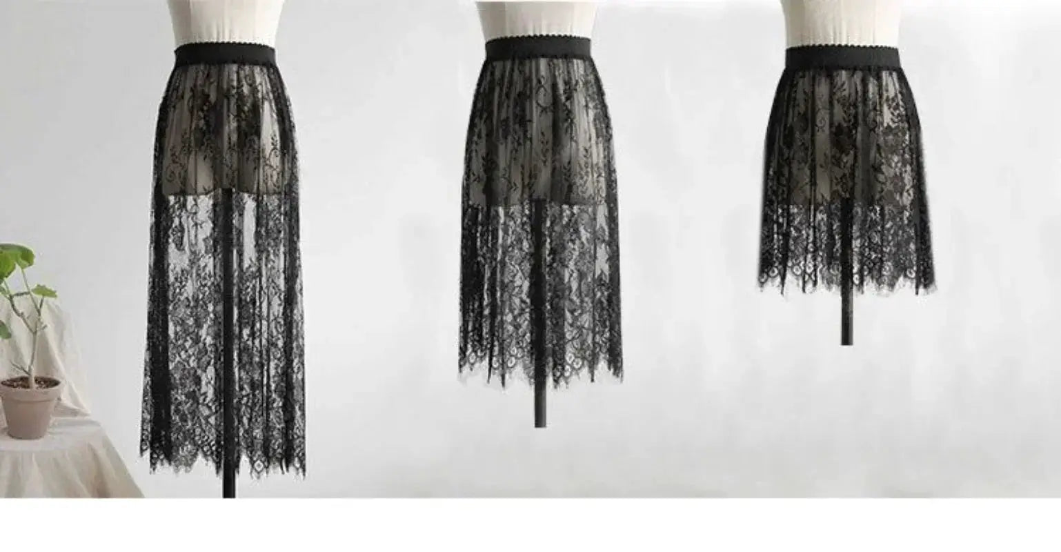 Three black lace high-waist slip underskirts on mannequins; sheer lace overlay with lining.