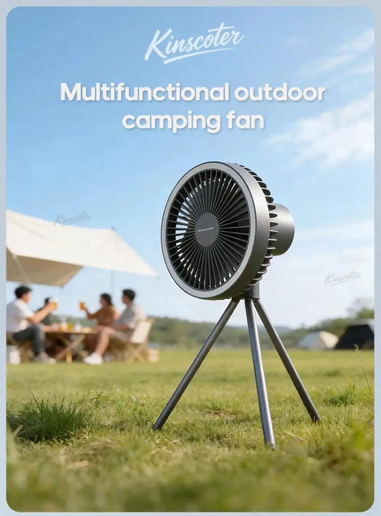 Camping fan on a tripod outdoors with a gray metal body; Kinscoter brand, rechargeable with LED lighting.