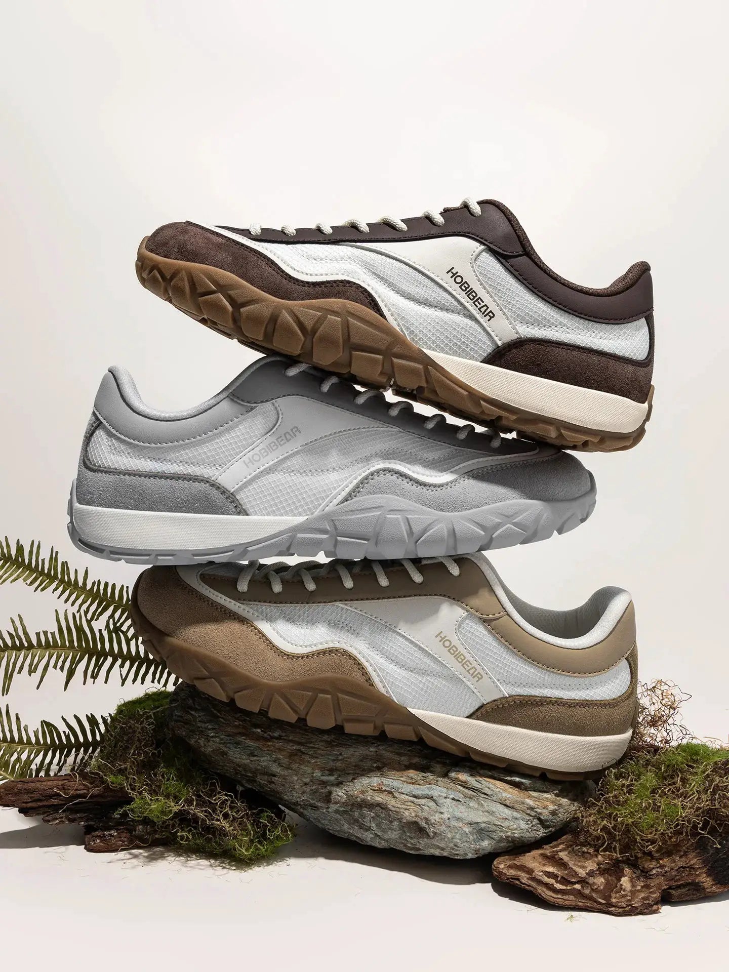 HOBIBEAR wide-width hiking shoes; unisex trekking sneakers in brown, gray and tan colorways, three pairs shown.