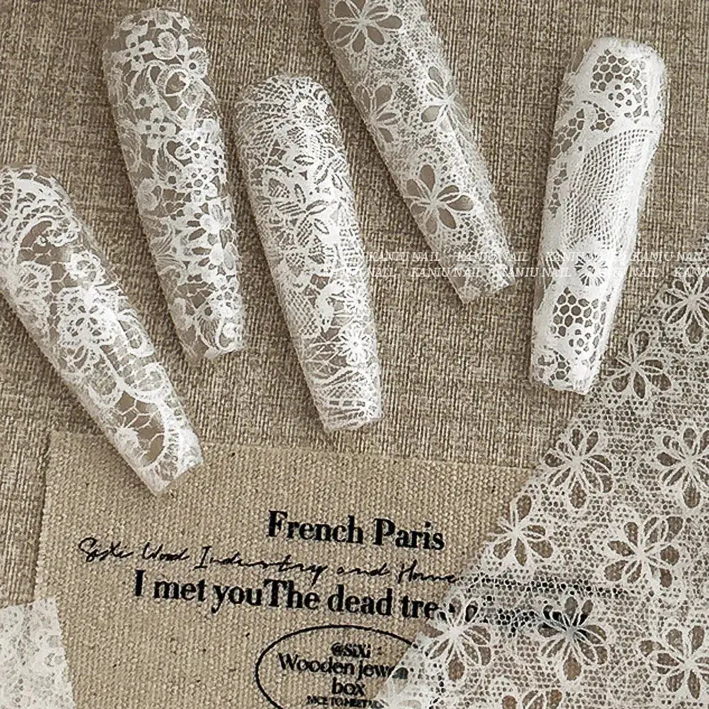 Lace nail transfer stickers with floral patterns, black and white, 10-roll box for full-wrap nails and French manicure.