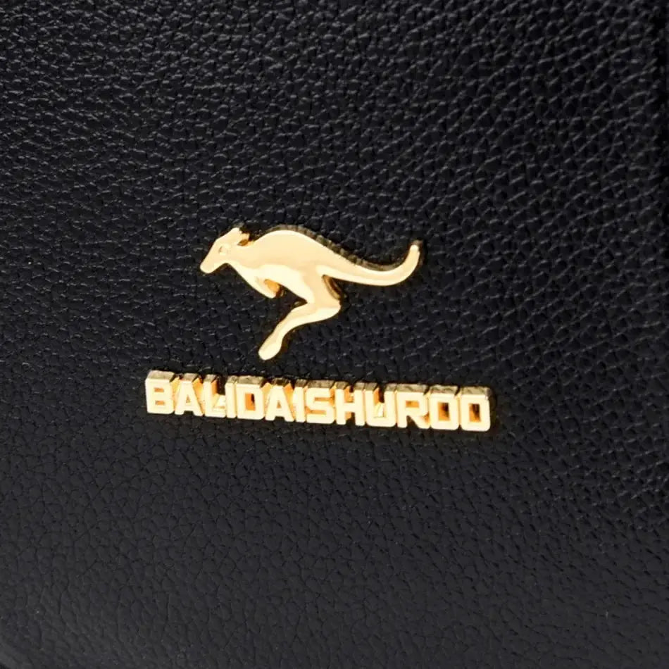 Women large-capacity leather backpack with gold BALDAISHUROO logo on black textured leather