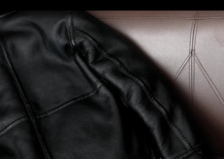 Black leather jacket close-up showing stitching and rich grain texture