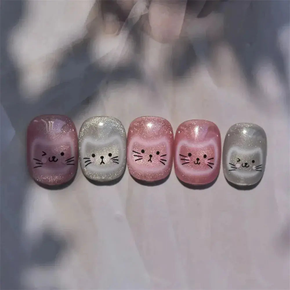 Nail art decals 5-piece cat-face set by Simples Market in pink, silver, and gray glitter