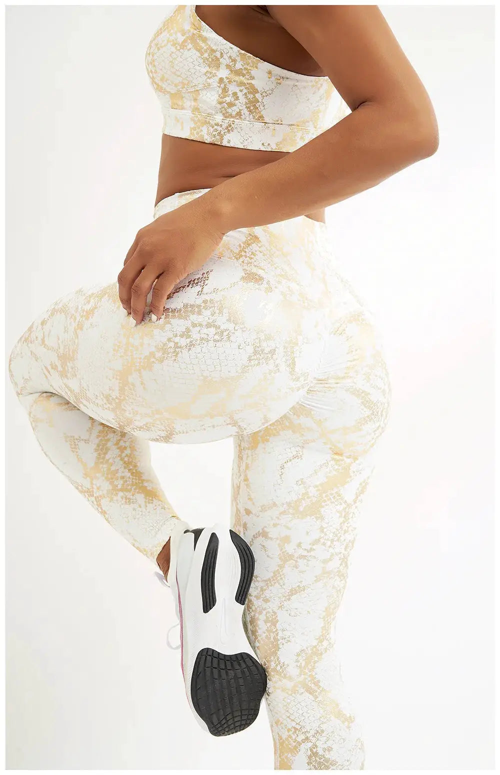 Snake-print yoga pants; beige-gold high-waist stretch leggings for women.