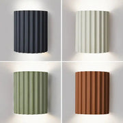 Nordic modern resin wall lamp by Simples Market; four color options shown: black, white, sage green, terracotta.