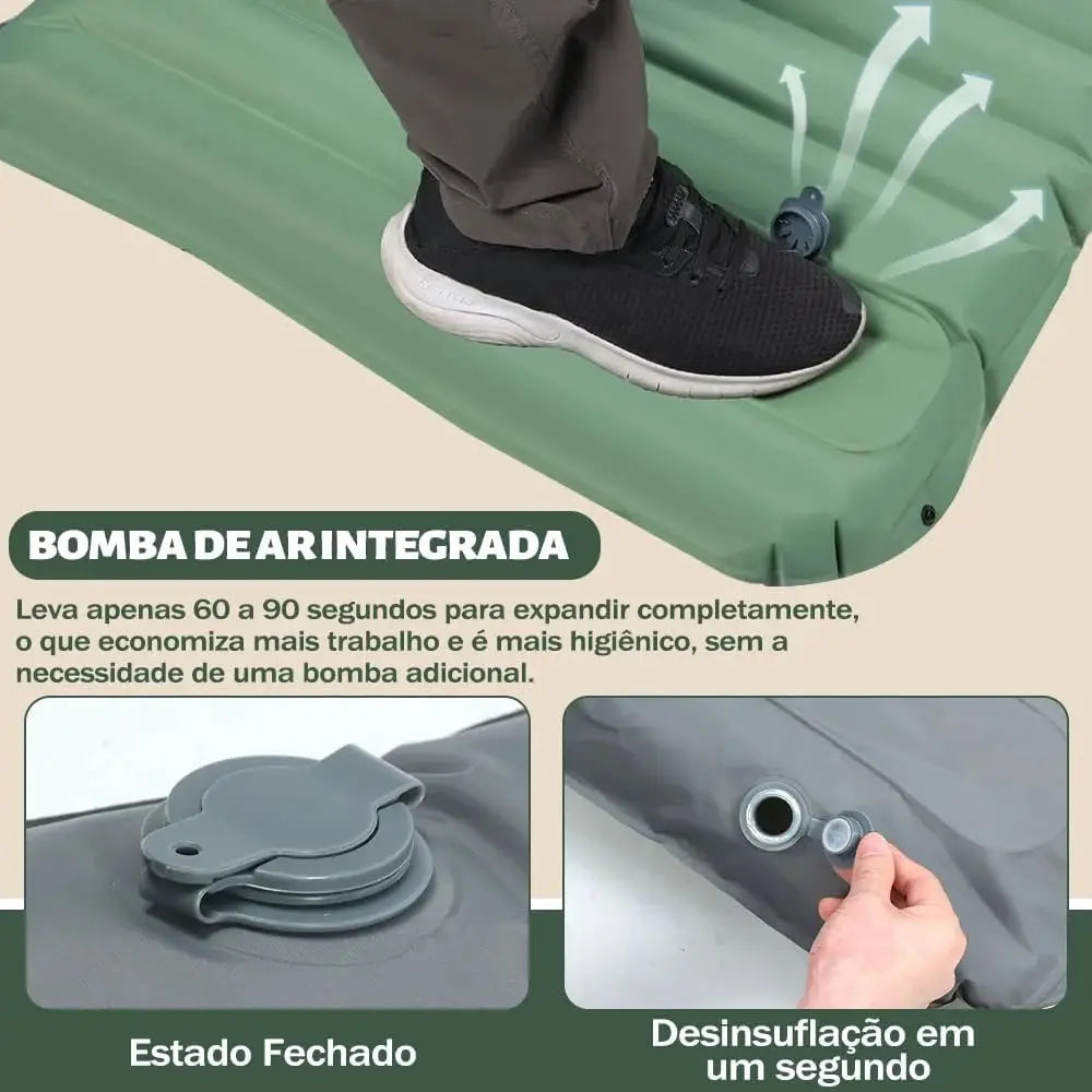 Green extra-thick 4-inch camping sleeping pad, self-inflating with integrated valve; foot stepping on it.