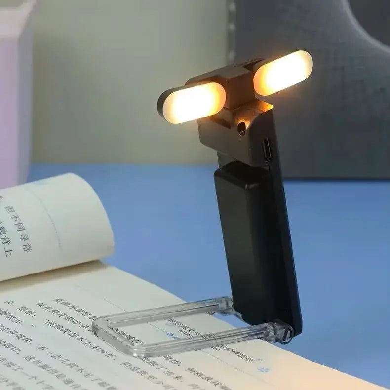 Simples Market USB-rechargeable reading light; black clip-on book light with dual warm LEDs.