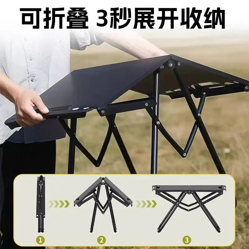 Portable folding camping table with black stainless-steel frame; compact outdoor table for camping, beach, and hiking.