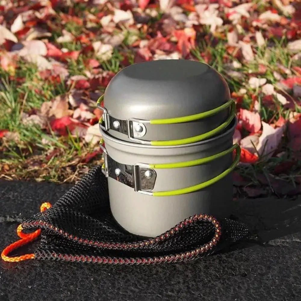 Camping mess kit by Simples Market; ultralight 3 gray stackable pots with lime-green bands and a black mesh carry bag