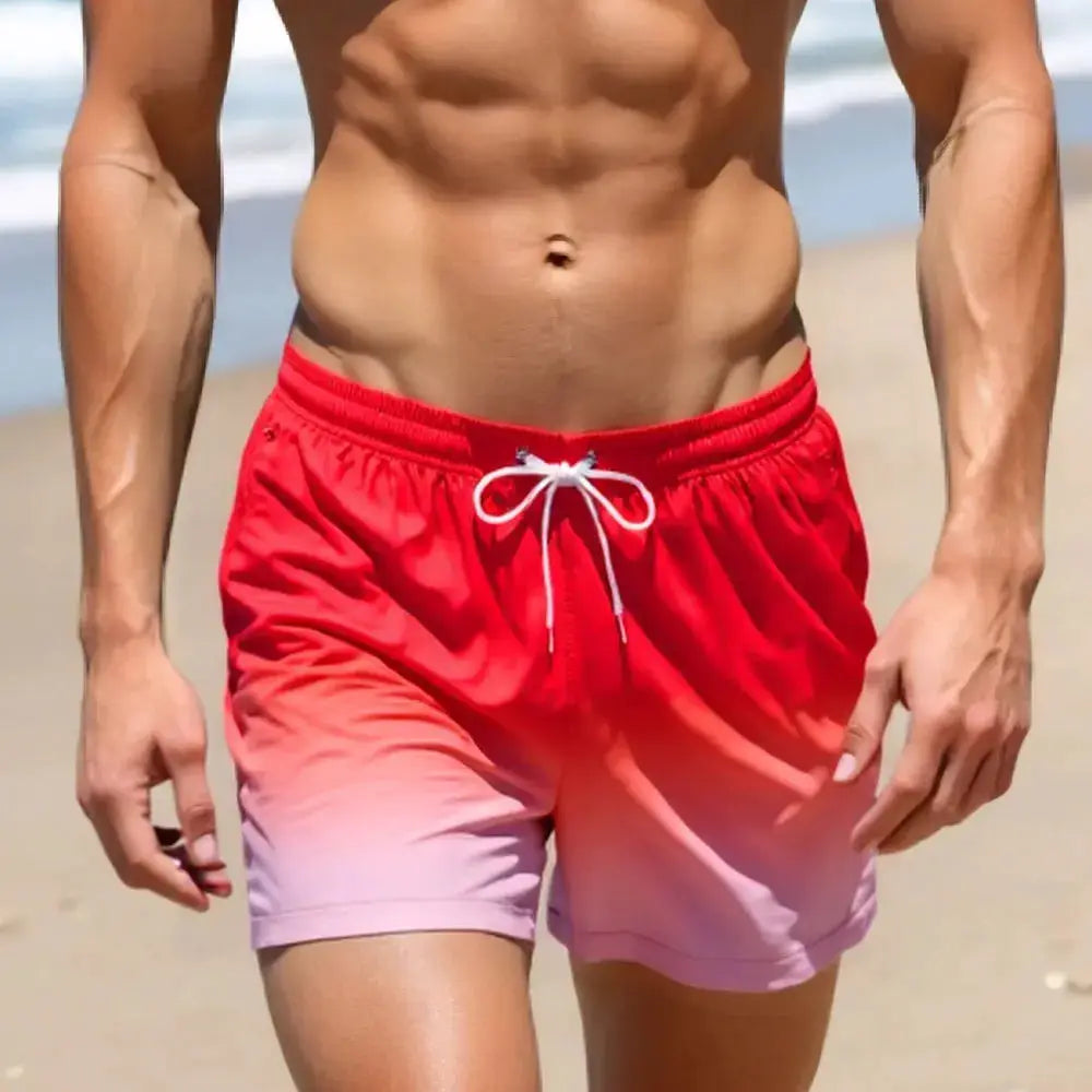 Men's swim trunks by Simples Market, red-to-pink gradient board shorts with white drawstring