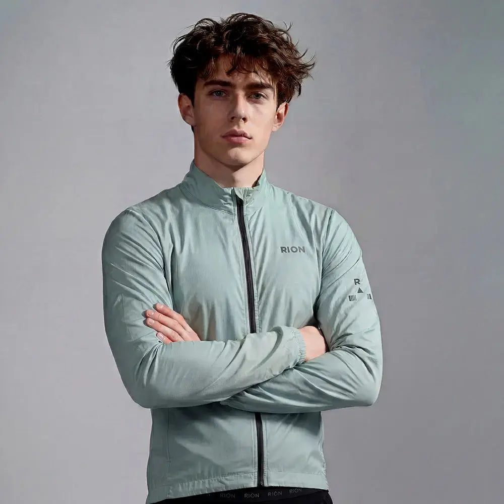 RION windbreaker jacket for men in sage green, lightweight windproof with zip-front, packable outdoor coat