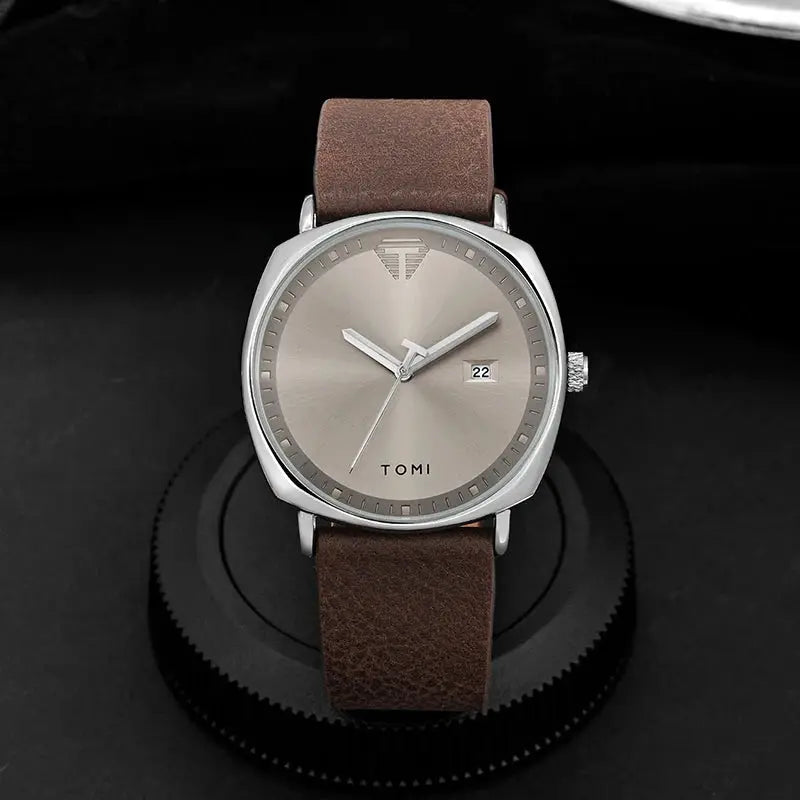 TOMI men's minimalist quartz watch with brown leather strap, stainless steel case, and date window