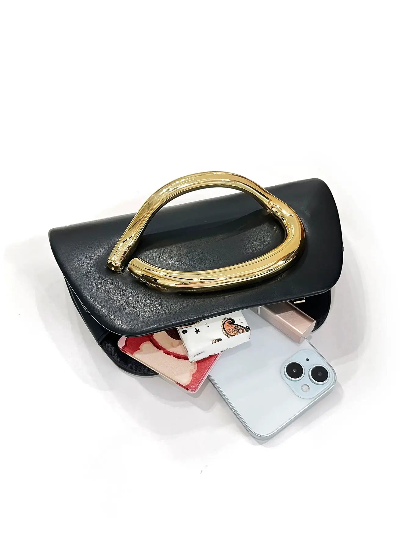 Box clutch black evening bag with a bold gold curved metal handle by Simples Market