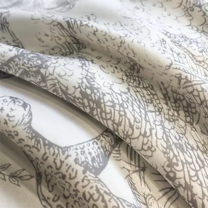 Bedding set by Simples Market in eucalyptus Lyocell with forest plant print in cream and gray.