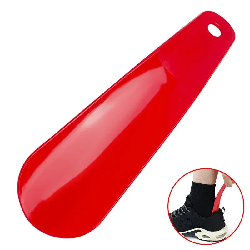 Red plastic spoon-shaped shoe horn with hanging hole; flexible and sturdy