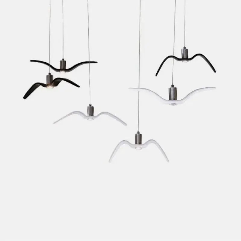Seagull design LED pendant lamp set by Simples Market; black and white bird-shaped chandeliers hanging from cords