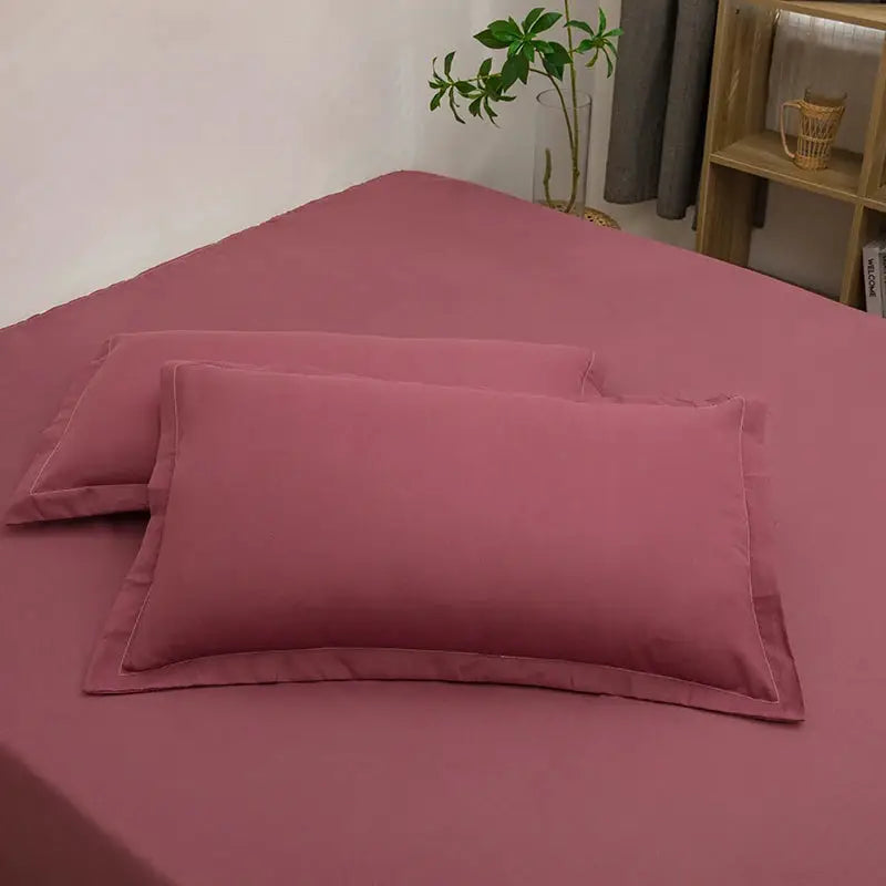 2pc pink envelope-style pillowcases on solid pink bedding