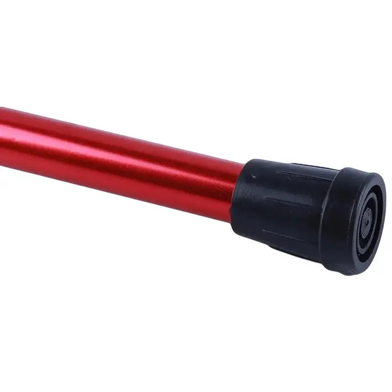 Telescopic adjustable red walking stick with aluminum alloy shaft and black end cap.