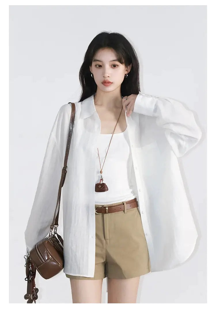 CHIC VEN white loose long-sleeve shirt worn open over white top with tan shorts and brown crossbody bag