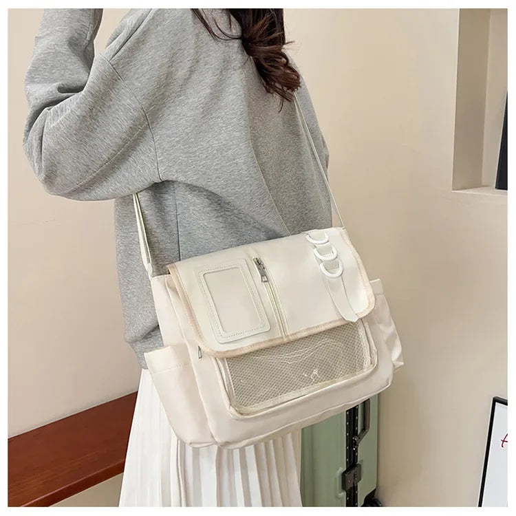 Ita bag crossbody in cream with transparent front panel and mesh pocket