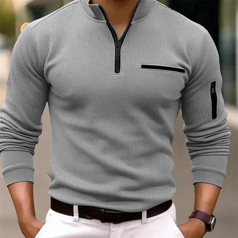 Men's gray ribbed zip-neck polo shirt with chest zip pocket and arm zip pocket