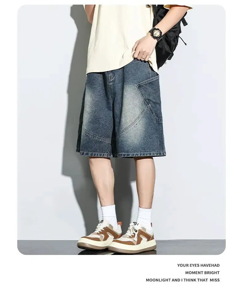 Baggy denim shorts with vintage wash and patchwork curved panels, knee-length straight fit