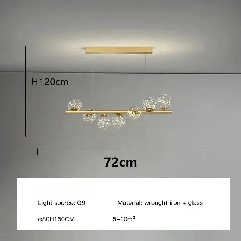 Nordic ceiling chandelier by Simples Market; gold wrought-iron bar with glass globe bulbs, 72cm wide.