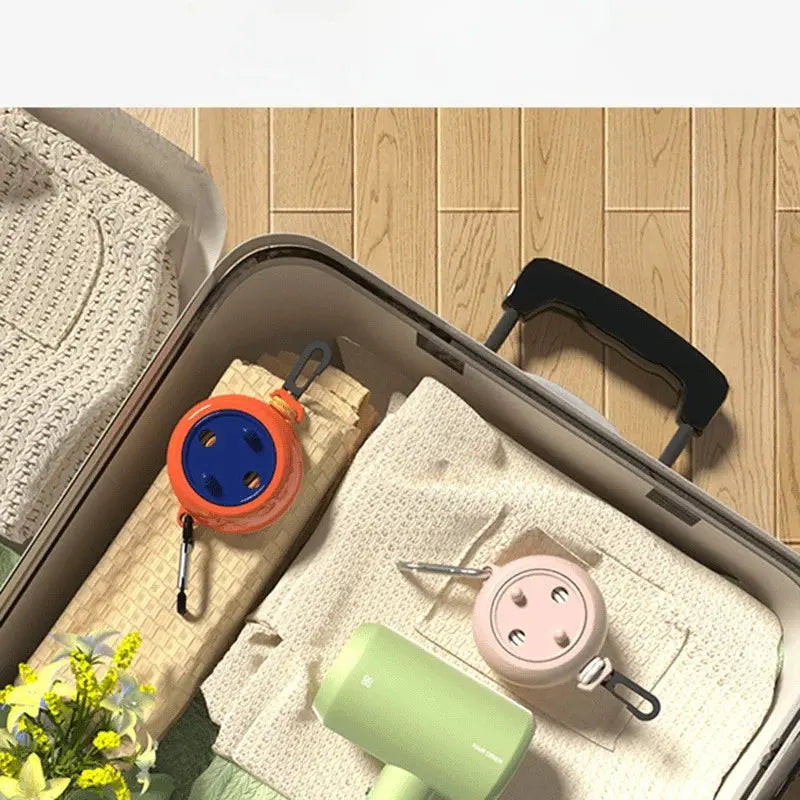 Simples Market 2-pack portable retractable clotheslines with windproof reels in orange and pink for travel drying.