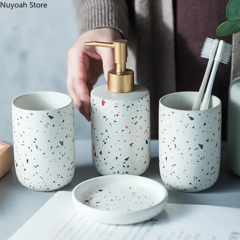 Simples Market European terrazzo ceramic bathroom set with brass pump emulsion bottle, two speckled cups, and soap dish.
