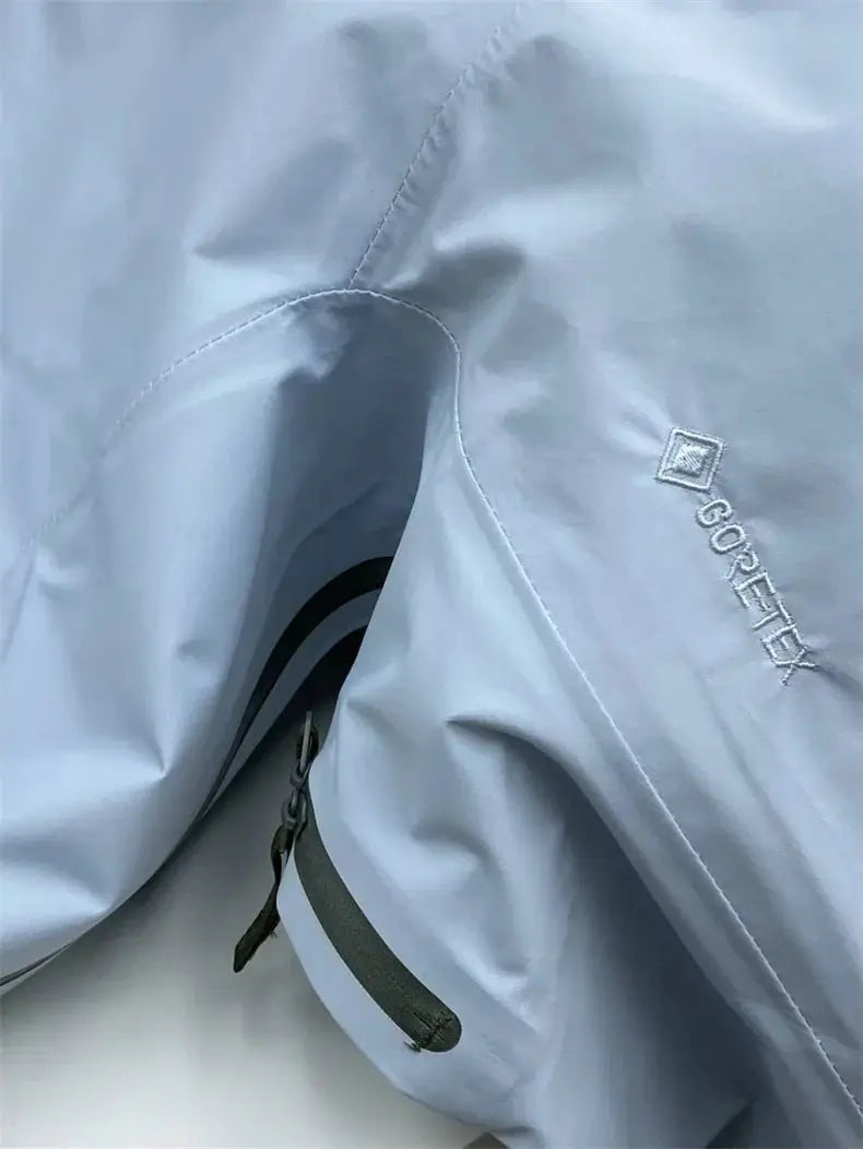 Light-blue GORE-TEX outdoor jacket, windproof soft-shell with adjustable strap