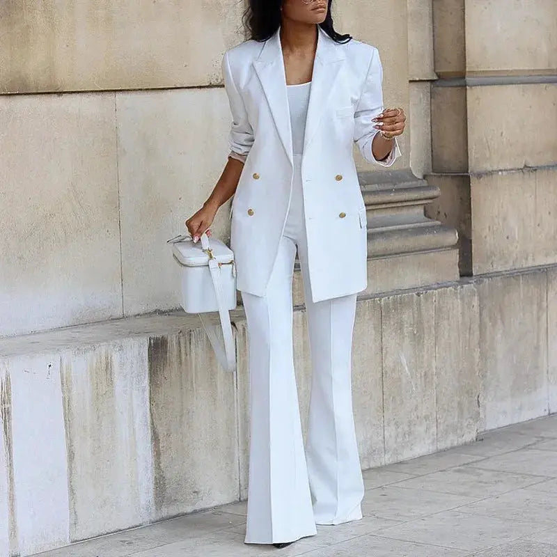 White two-piece blazer set with gold-button jacket and straight-leg pants