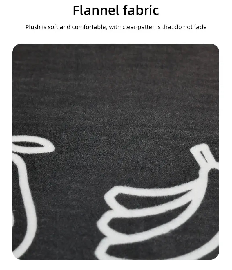 Flannel fabric close-up in black with white abstract curved pattern.