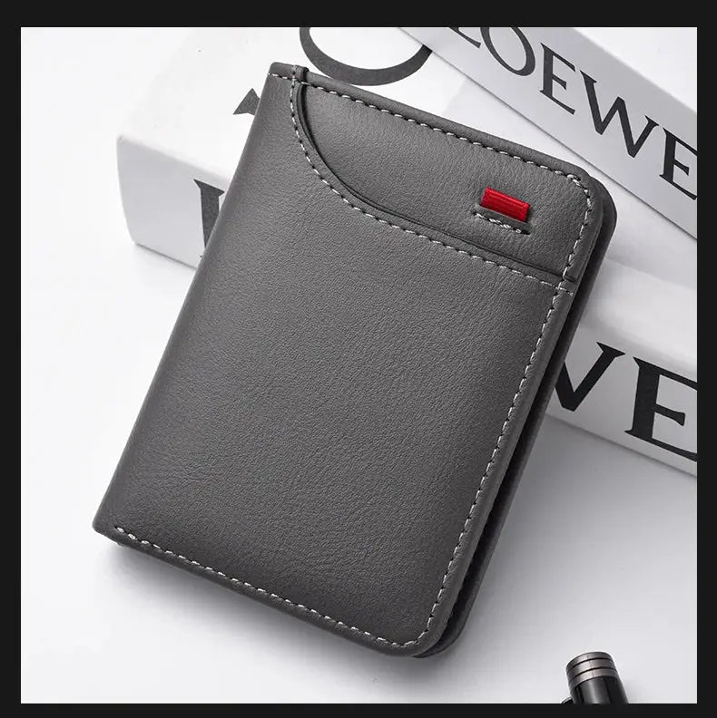 Men's gray leather vertical card wallet with white stitching and red accent detail.