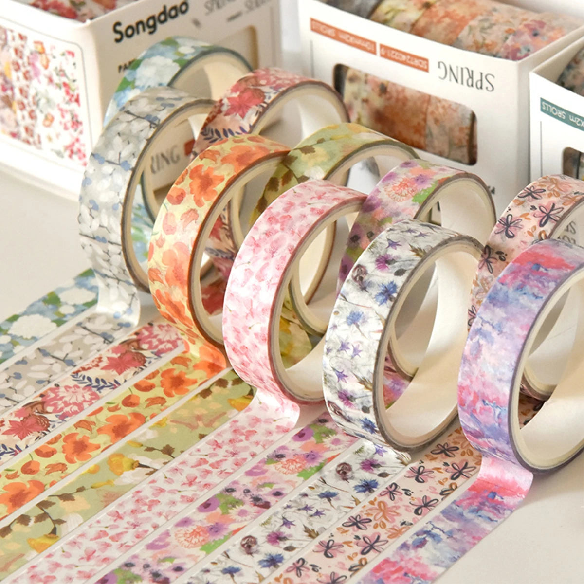 Five floral washi tape rolls in pastel colors, decorative DIY tape display