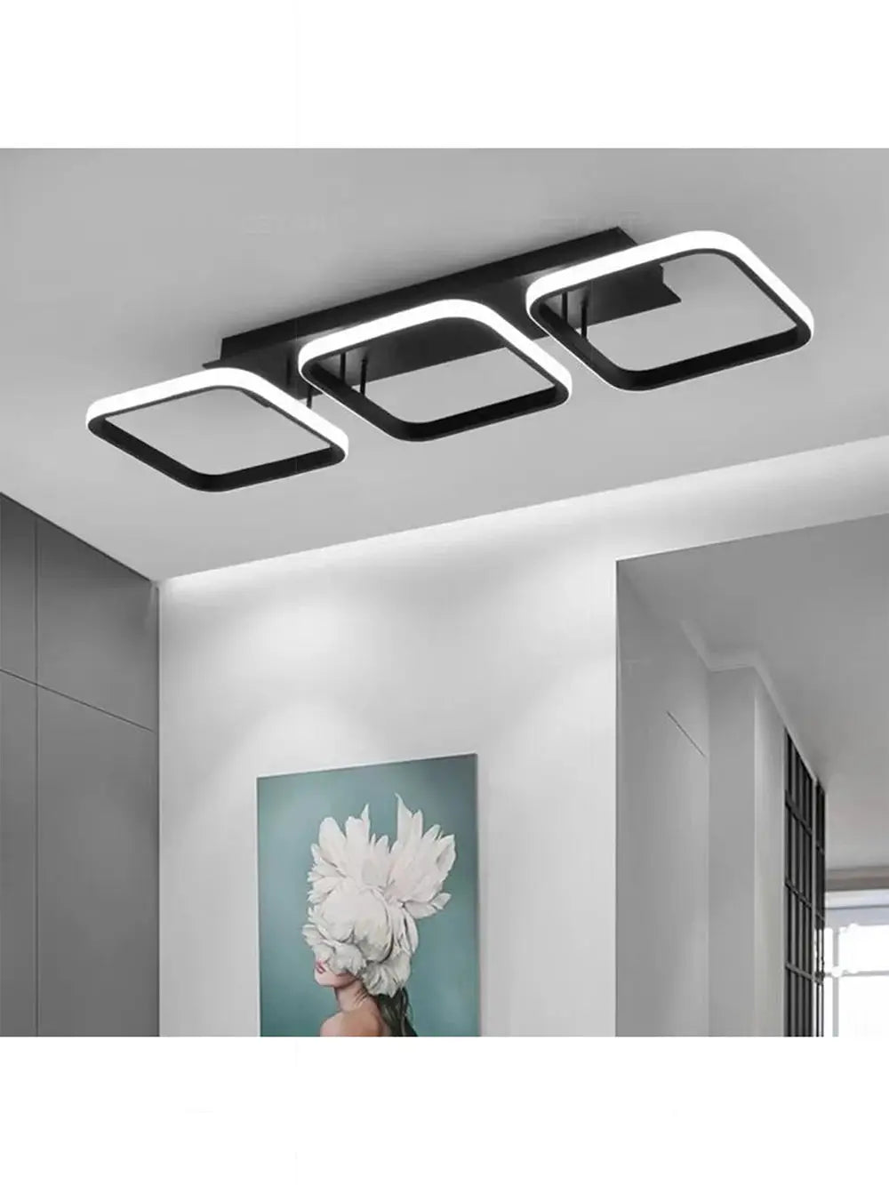 LED ceiling light by Simples Market; triple black square-ring luminaire with white LED edges.
