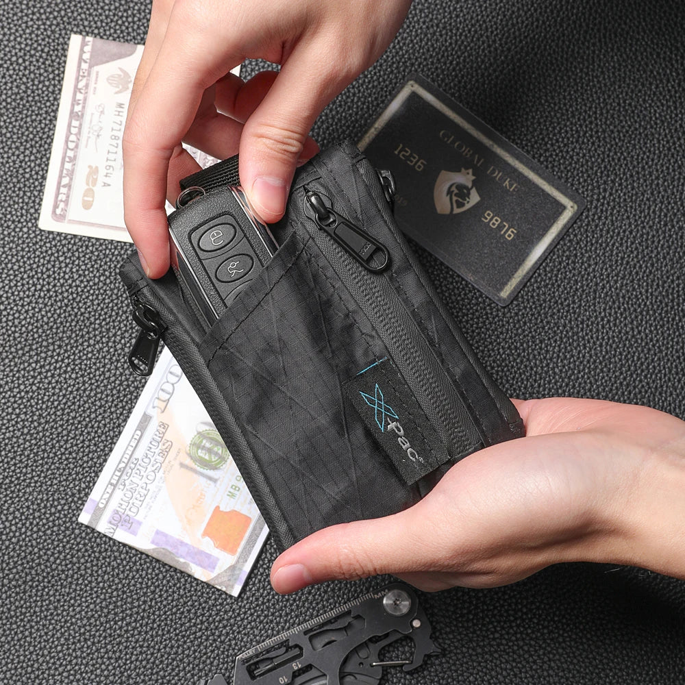Black X-PAC EDC 5-pocket wallet with YKK zipper, keychain clip, and coin/card pouches.