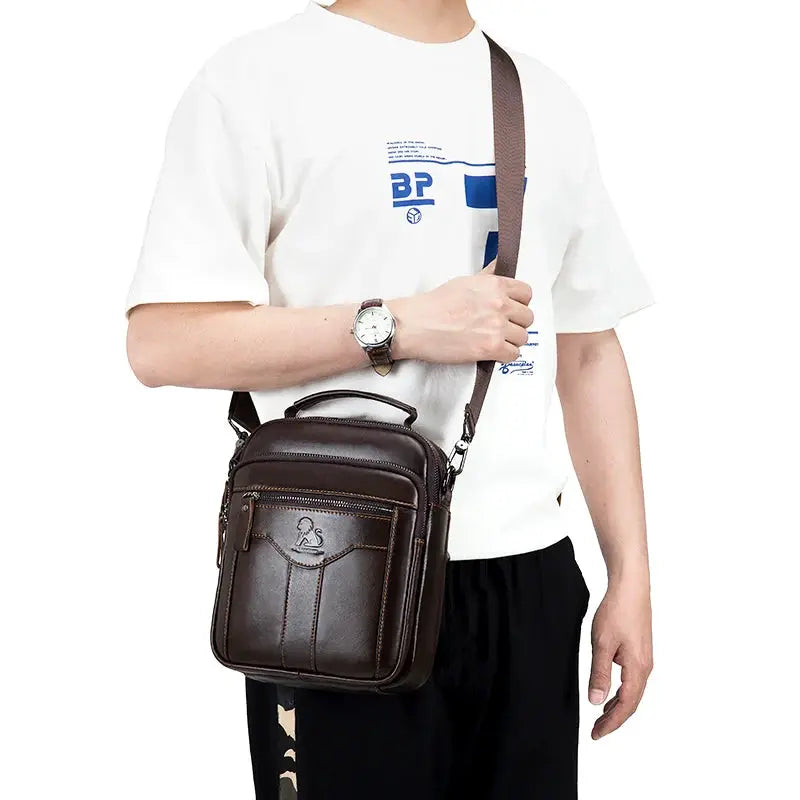 Men's brown leather crossbody bag with front zip pocket and adjustable strap by Simples Market