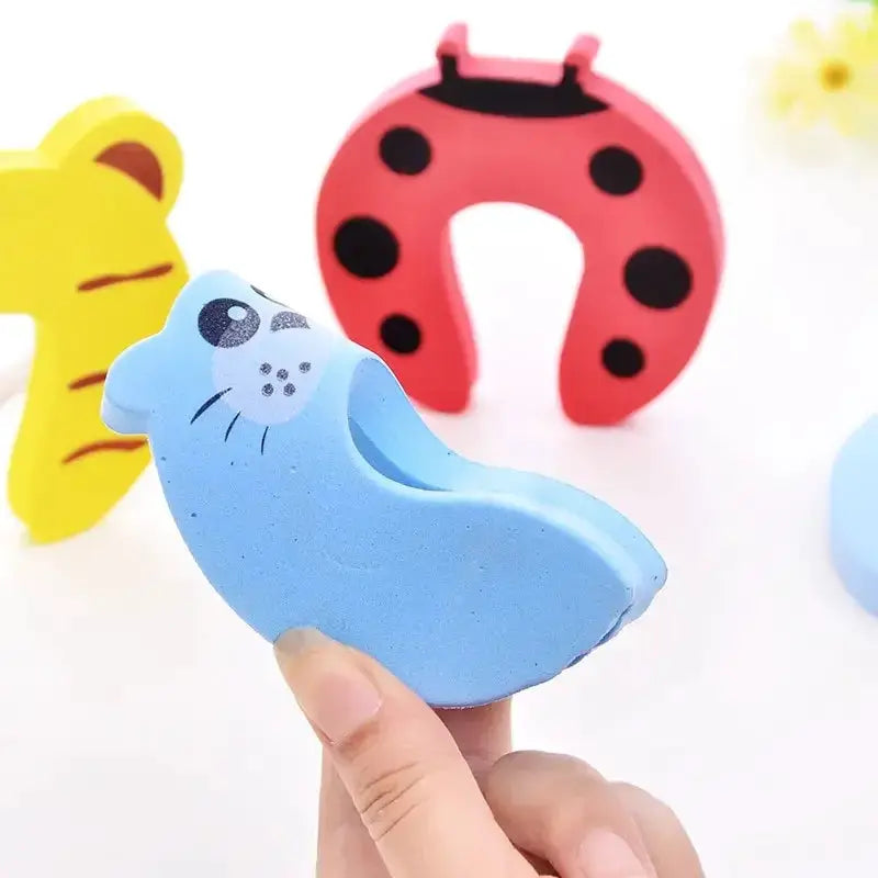 Baby safety door stopper by Simples Market, blue cartoon animal, anti-pinch finger protector; set of 3
