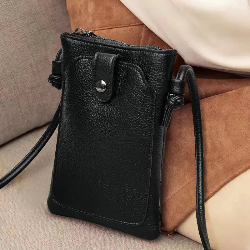 Simples Market PU leather diagonal crossbody bag, black, with buckle flap and long shoulder strap.