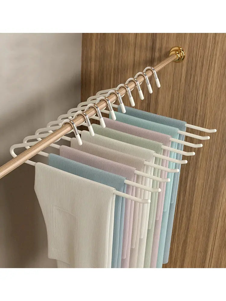 Simples Market 30-piece goose-shaped pants rack with anti-slip clips on a wooden rod, pastel wardrobe pant hangers