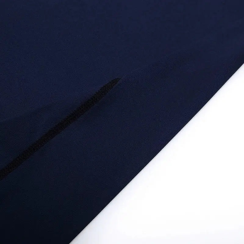 Men's running compression T-shirt navy fabric close-up with a black seam accent