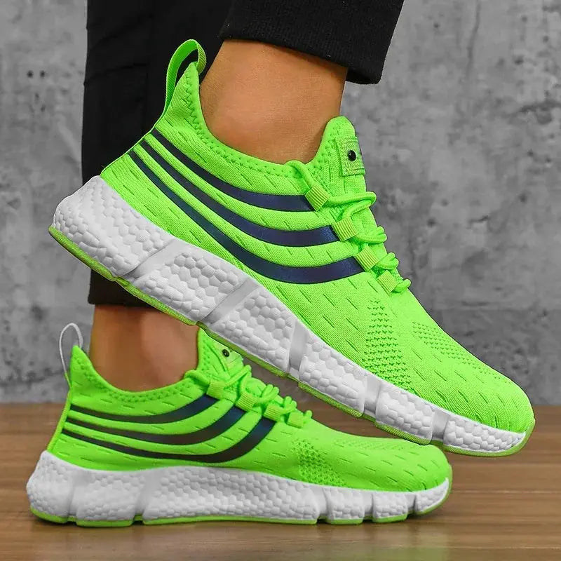 Men’s sneakers pair with neon-green knit uppers, navy stripes, and a chunky white platform sole