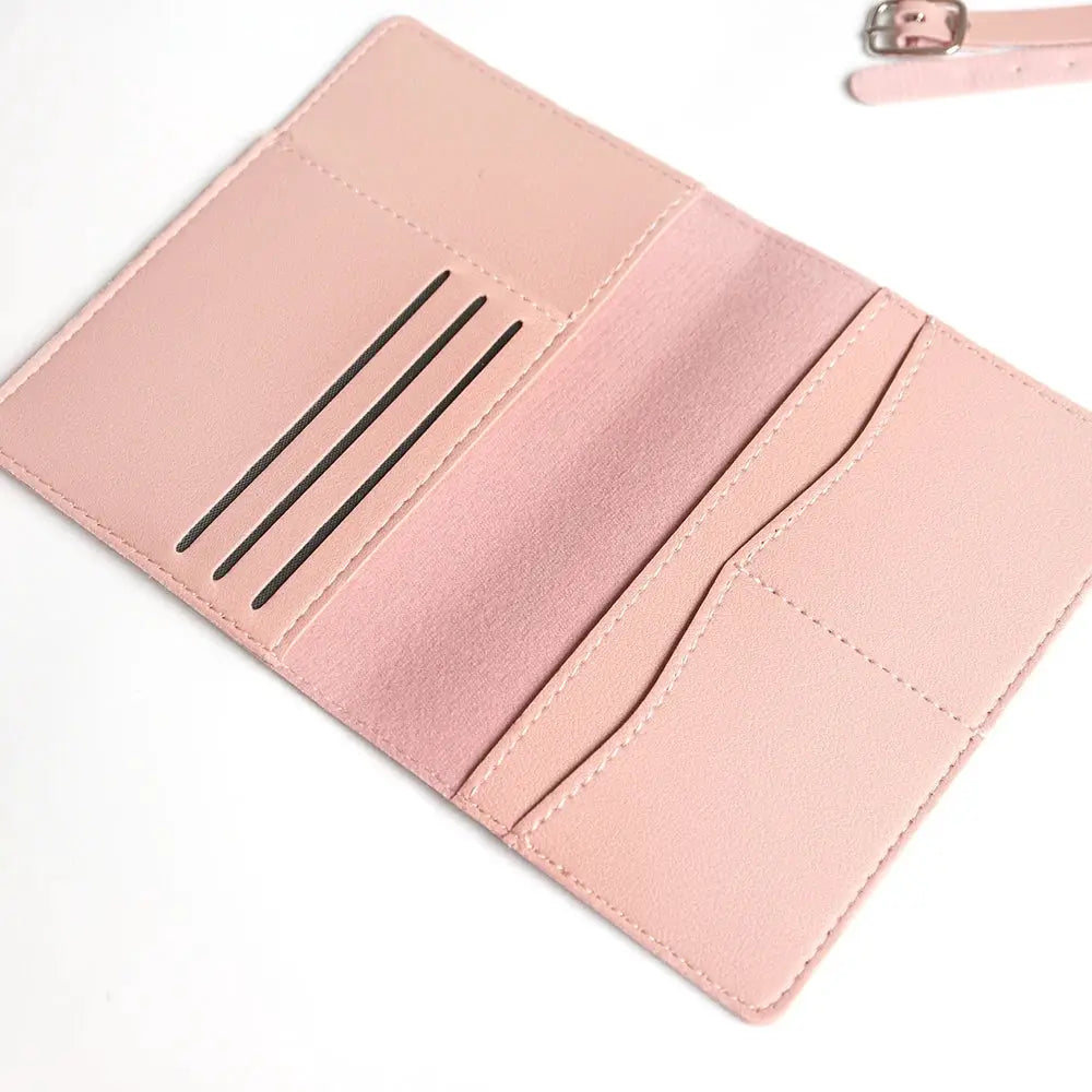 Travel passport cover set in pink with card slots and luggage tag strap.