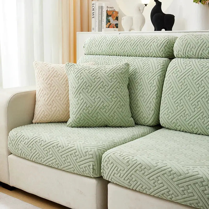 Thick sofa seat cushion cover in green jacquard fabric with geometric lattice pattern.