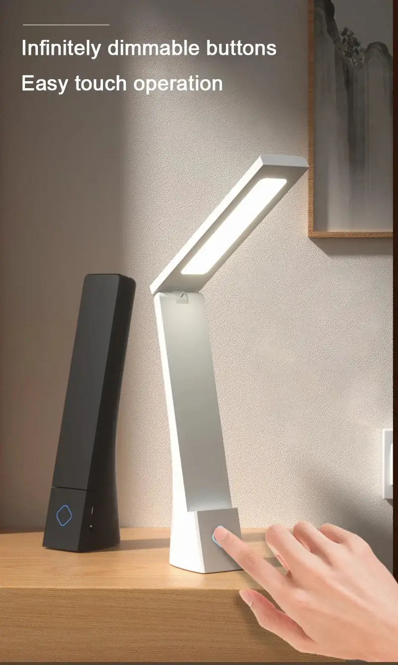 Simples Market LED desk lamp foldable with touch dimming on white base, beside a black charging device