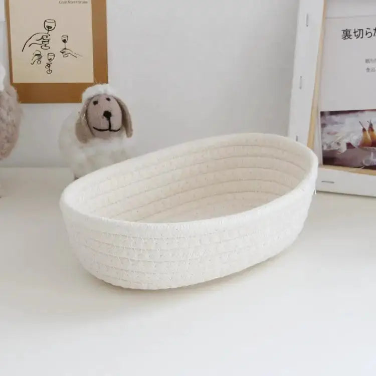 Woven white storage basket for desk organization; multifunctional for cosmetics, toys and stationery.