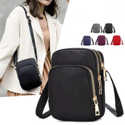 Simples Market women's waterproof crossbody bag with dual zipper pockets and shoulder strap, black