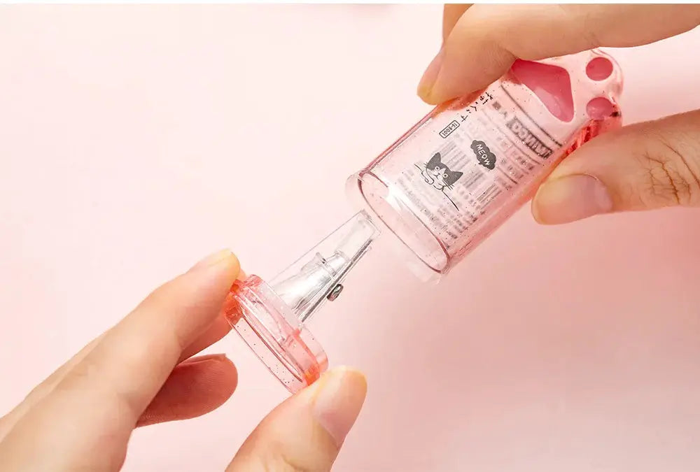 Kawaii cat paw pencil sharpener, pink translucent plastic from Simples Market.