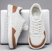 Pair of men's white casual sneakers with tan leather accents, Simples Market lace-up running shoes